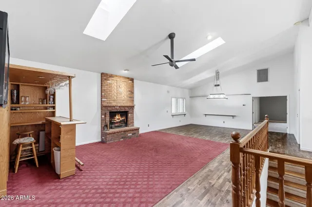 a view of a livingroom with a furniture and kitchen view
