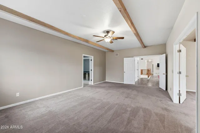 a kitchen with granite countertop a stove and a large window