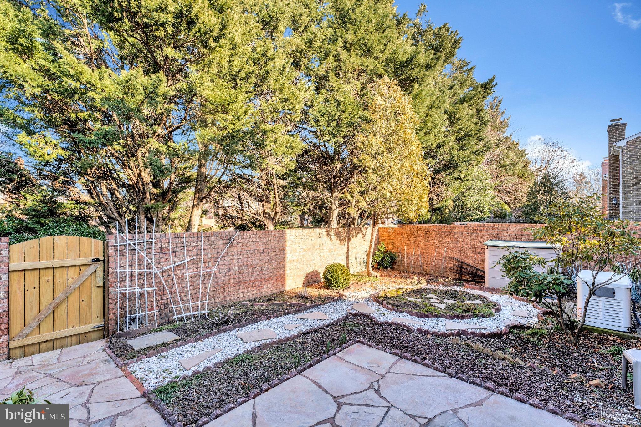 7346 Eldorado Street McLean, VA 22102 - Photo 14 of 48 a view of a yard with plants and trees