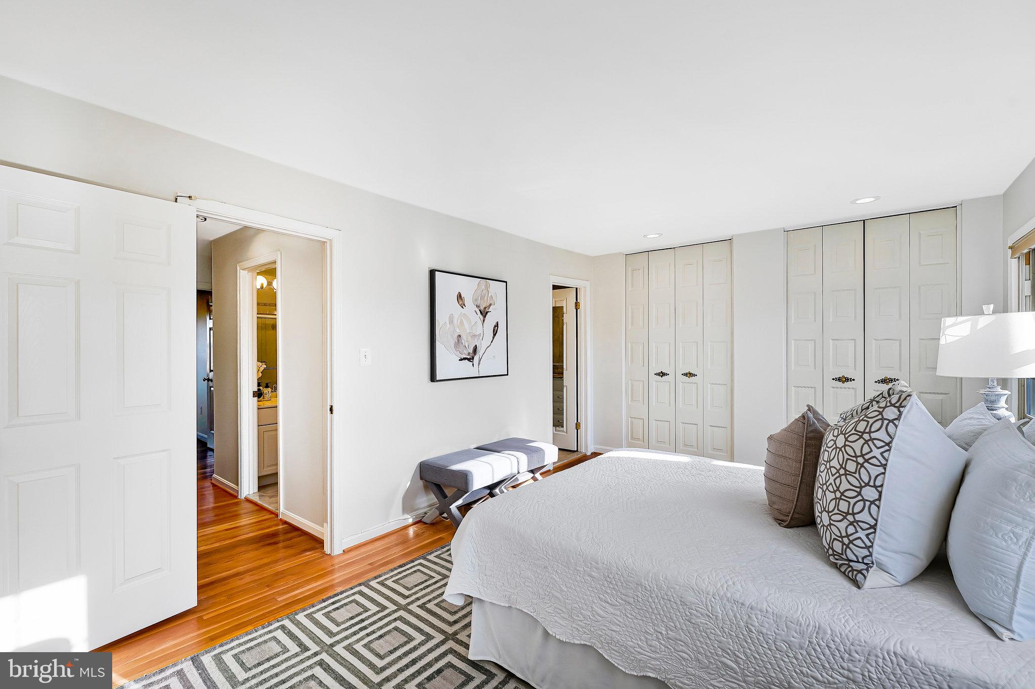 7346 Eldorado Street McLean, VA 22102 - Photo 24 of 48 a bedroom with a bed and wooden floor