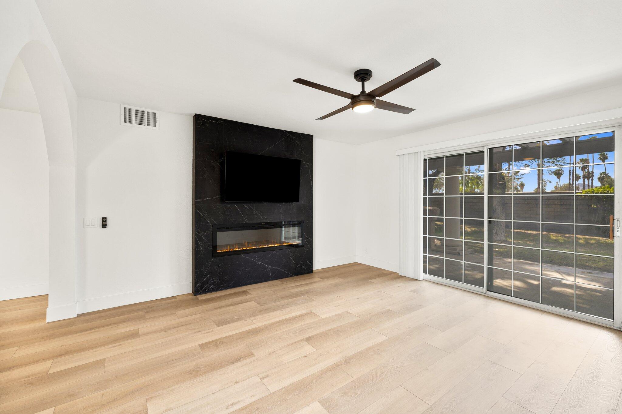 505 South Farrell Drive, Unit A3 Palm Springs, CA 92264 - Photo 12 of 43 a view of empty room with wooden floor and fan