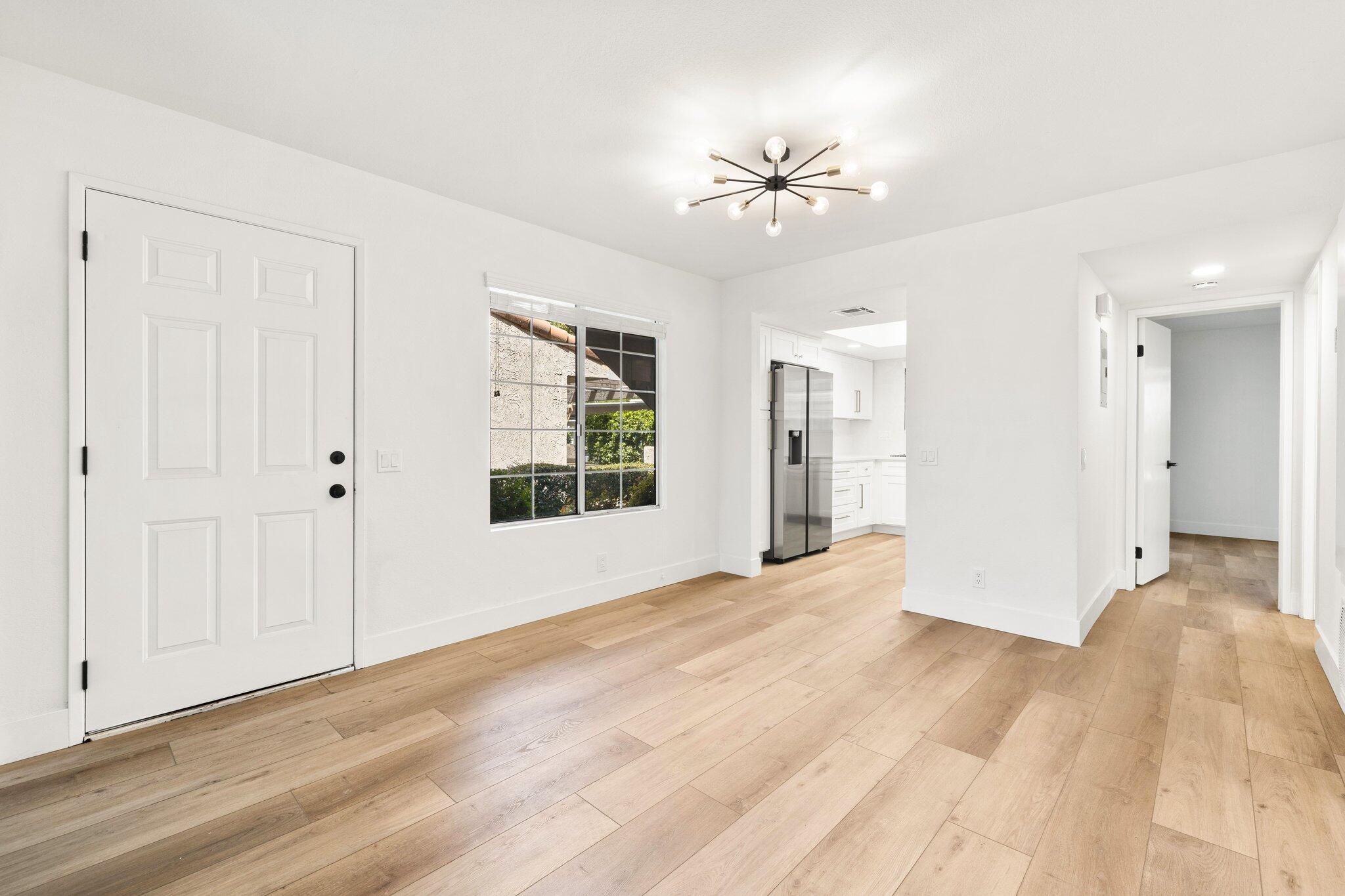 505 South Farrell Drive, Unit A3 Palm Springs, CA 92264 - Photo 16 of 43 a view of an empty room with wooden floor and a window