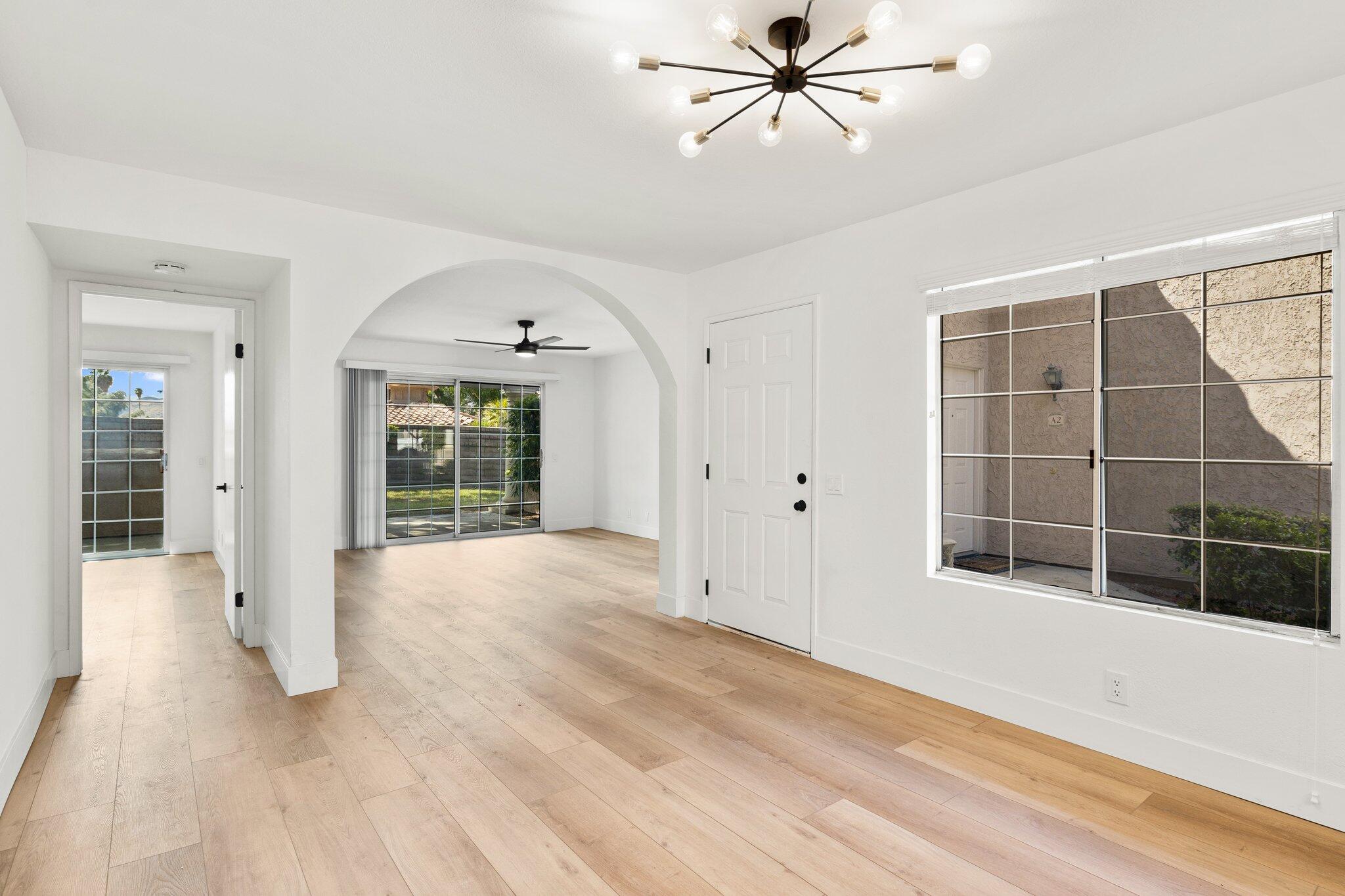 505 South Farrell Drive, Unit A3 Palm Springs, CA 92264 - Photo 19 of 43 wooden floor in an empty room with a window