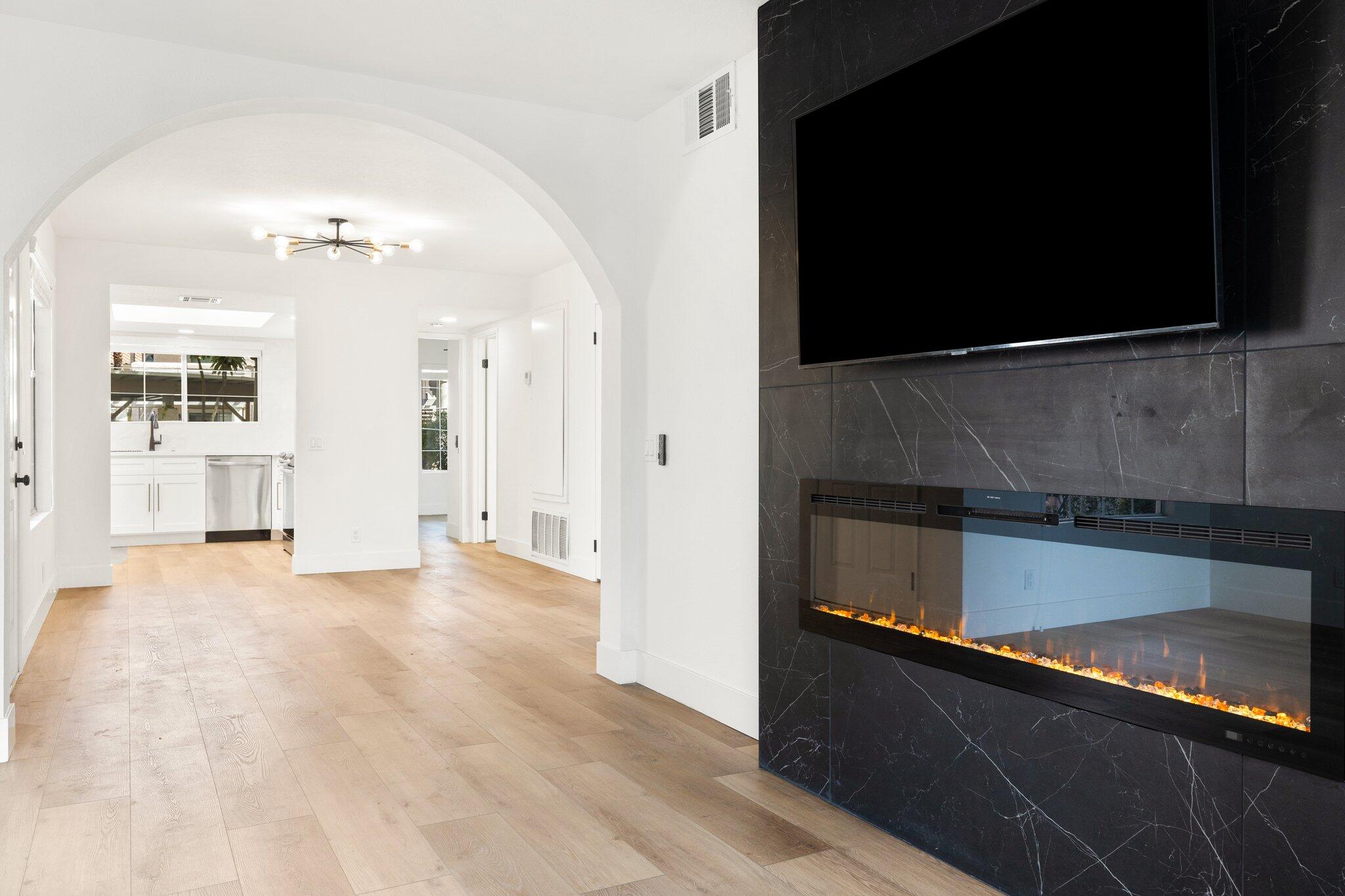 505 South Farrell Drive, Unit A3 Palm Springs, CA 92264 - Photo 2 of 43 wooden floor in an empty room with a fireplace