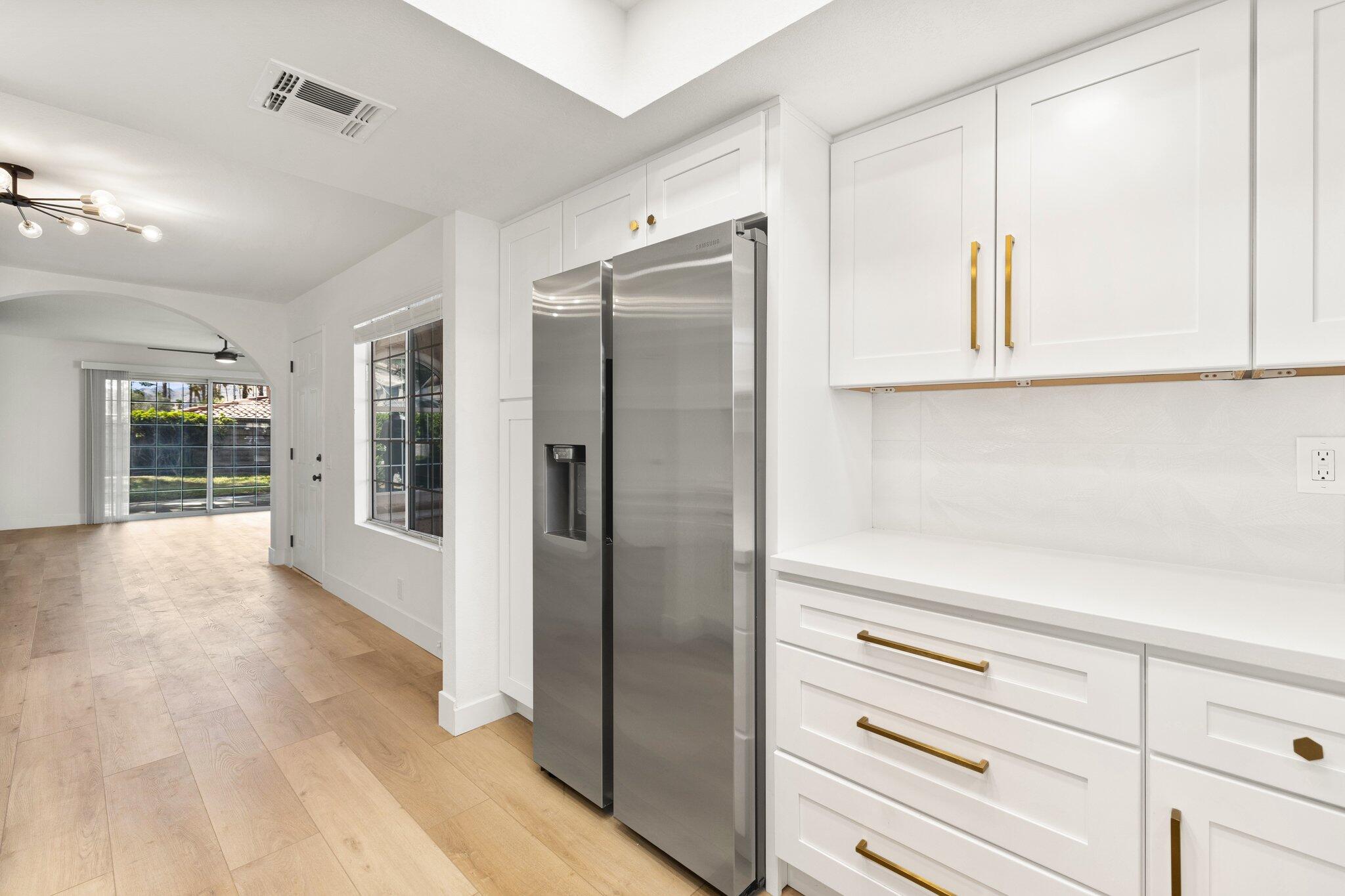 505 South Farrell Drive, Unit A3 Palm Springs, CA 92264 - Photo 23 of 43 a view of kitchen with wooden floor and cabinet