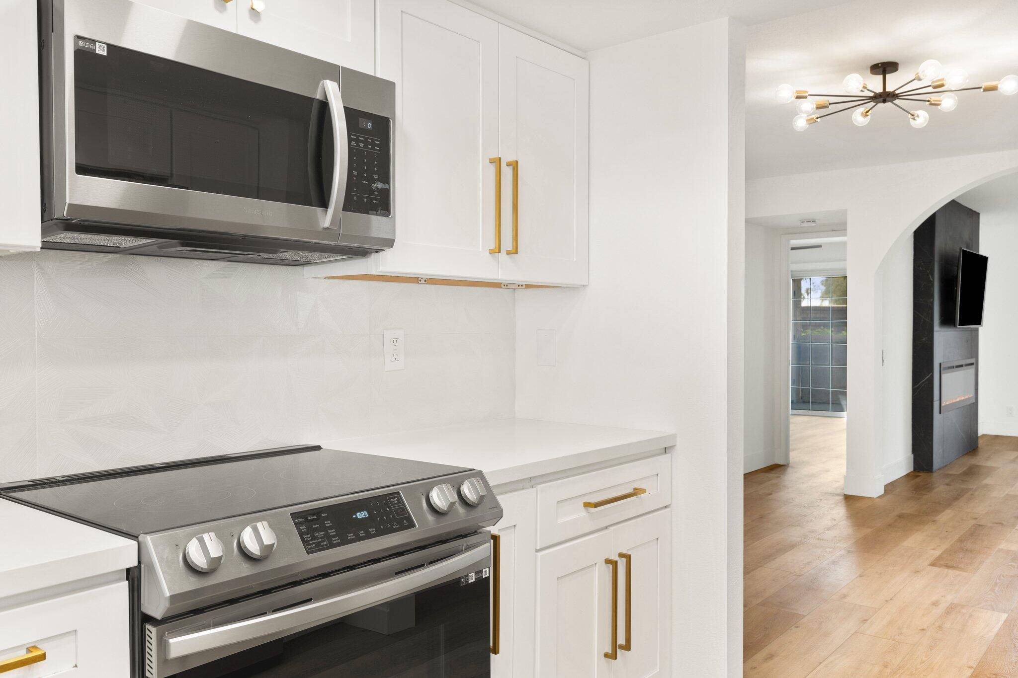 505 South Farrell Drive, Unit A3 Palm Springs, CA 92264 - Photo 24 of 43 a kitchen with a stove and a microwave