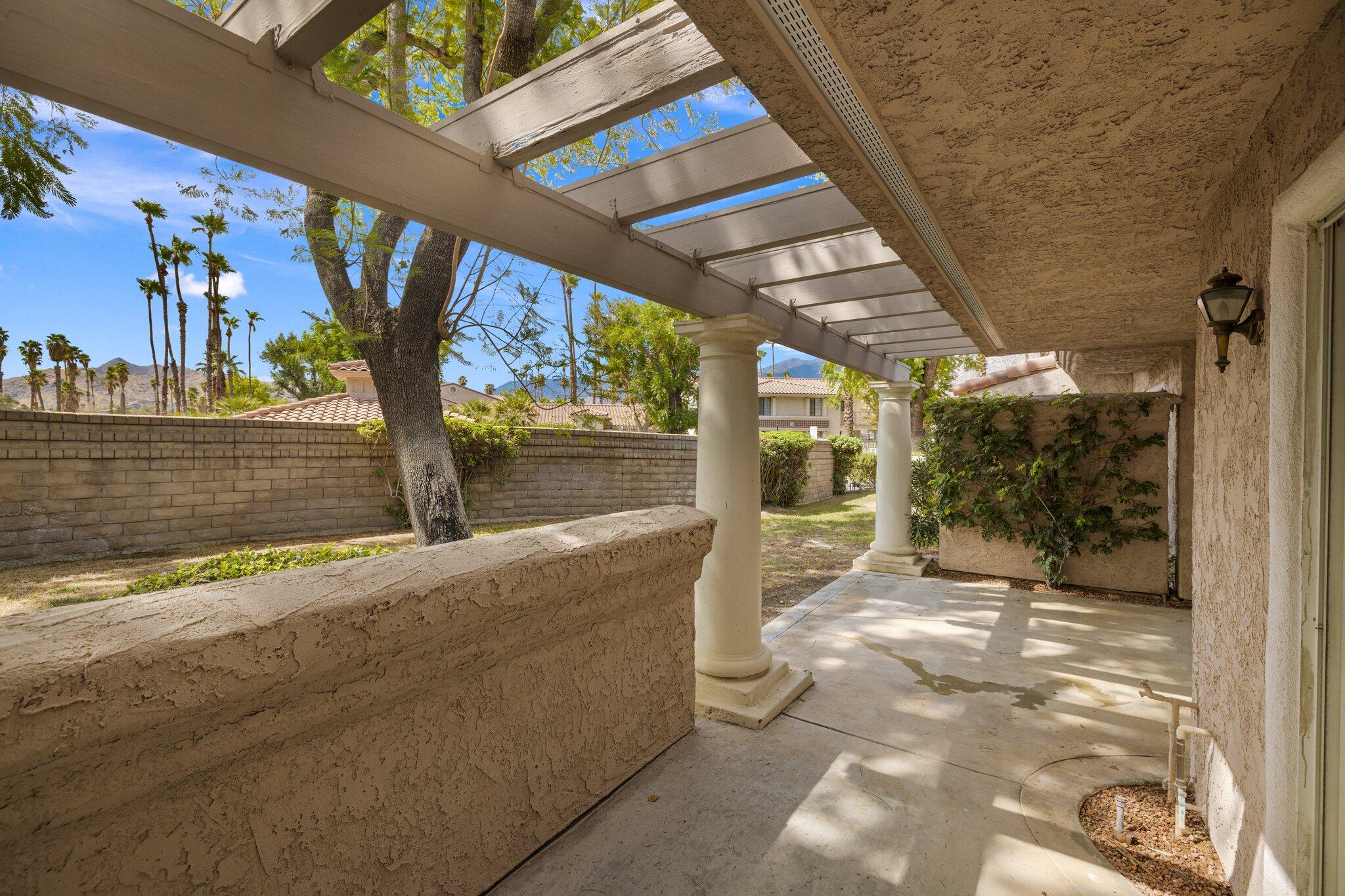 505 South Farrell Drive, Unit A3 Palm Springs, CA 92264 - Photo 27 of 43 a view of a patio with wooden floor