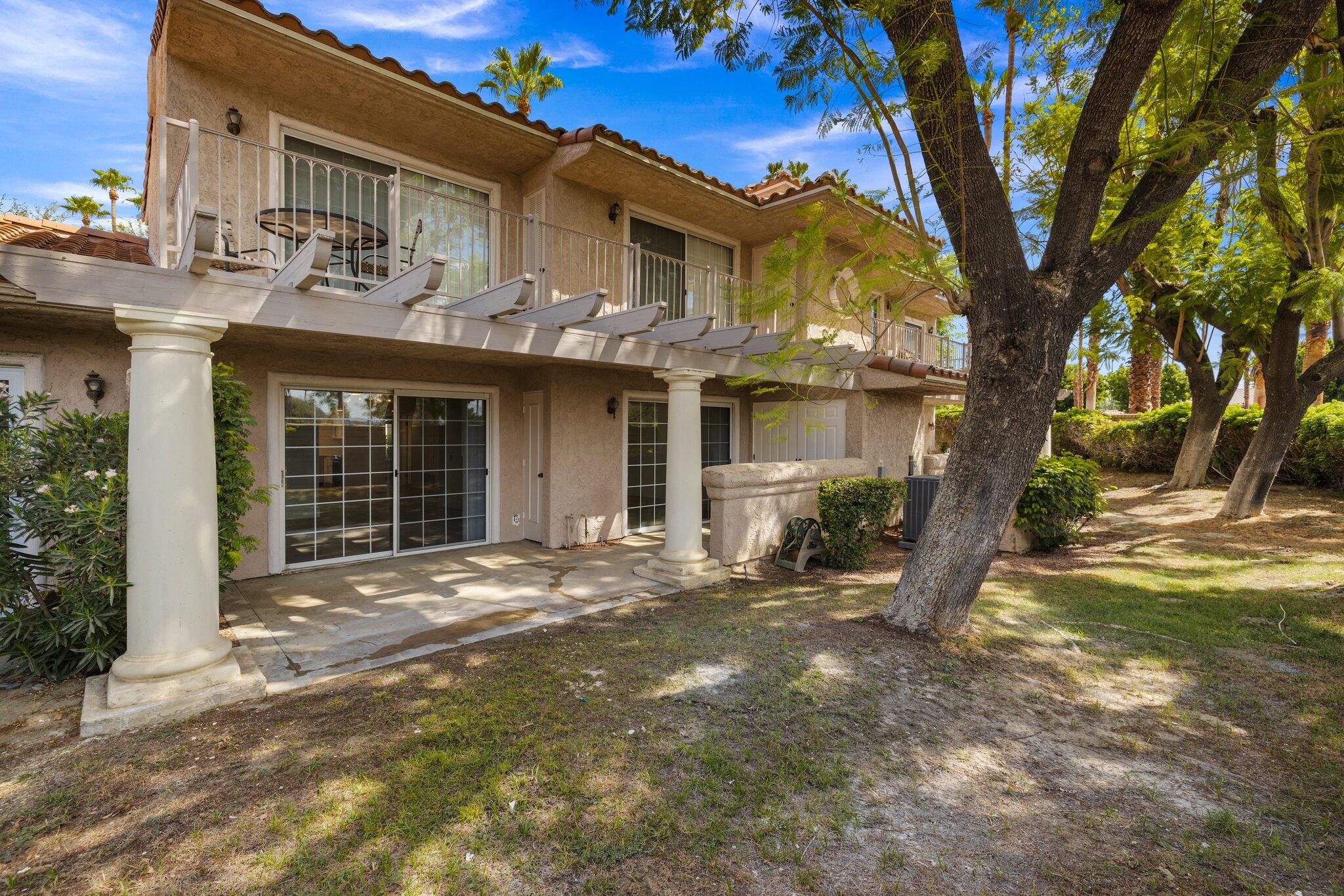505 South Farrell Drive, Unit A3 Palm Springs, CA 92264 - Photo 28 of 43 a view of a house with a tree in front of it