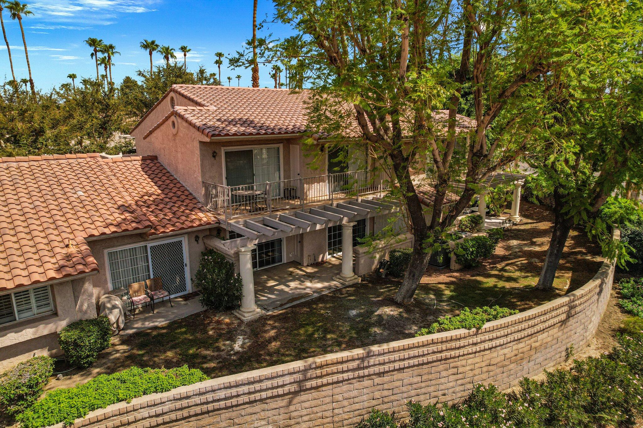 505 South Farrell Drive, Unit A3 Palm Springs, CA 92264 - Photo 36 of 43 front view of a house with a small yard