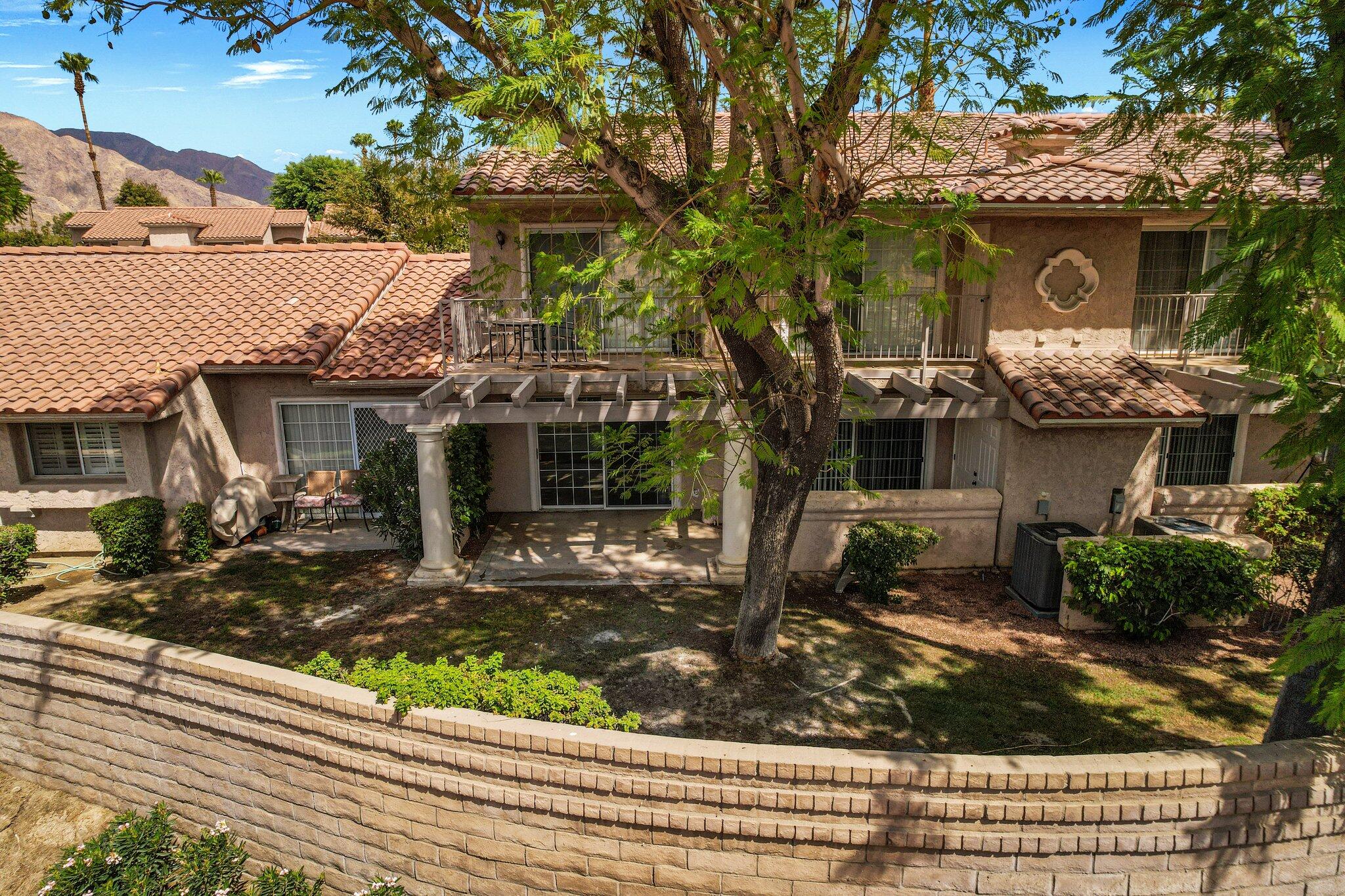 505 South Farrell Drive, Unit A3 Palm Springs, CA 92264 - Photo 37 of 43 front view of a house with a tree