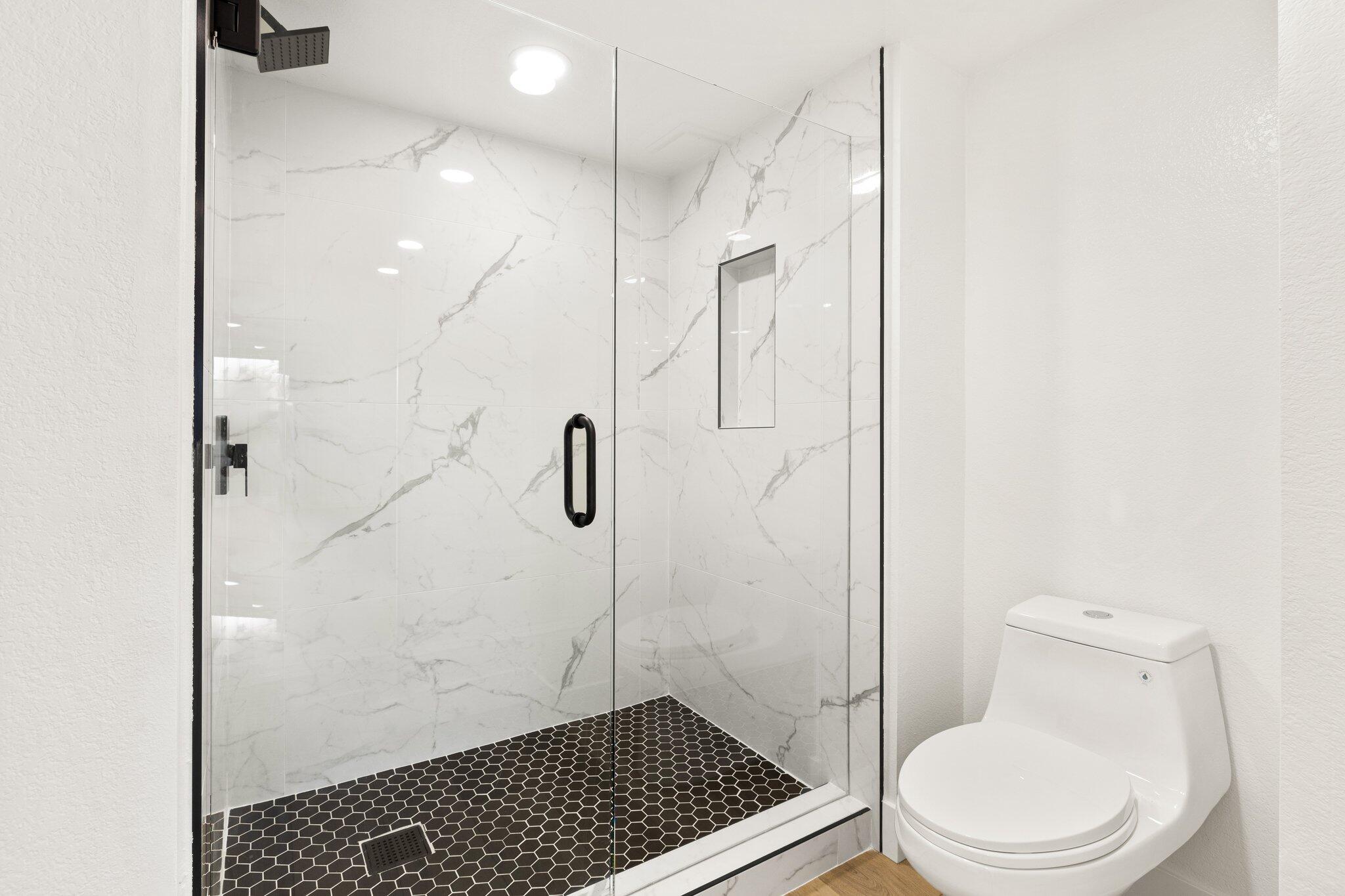 505 South Farrell Drive, Unit A3 Palm Springs, CA 92264 - Photo 6 of 43 a bathroom with a toilet and a shower