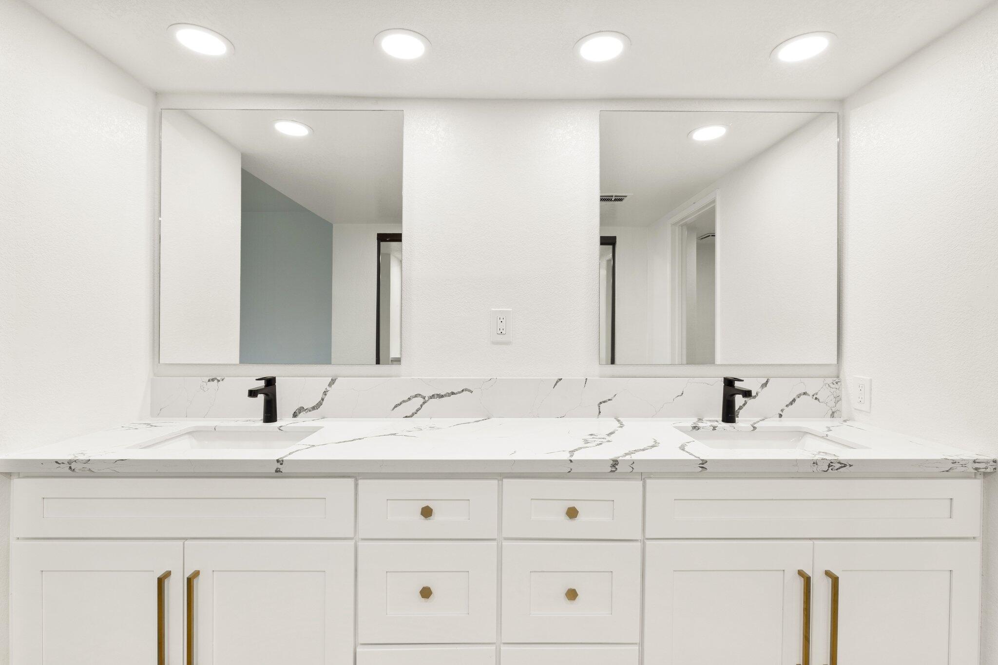 505 South Farrell Drive, Unit A3 Palm Springs, CA 92264 - Photo 7 of 43 a bathroom with double vanity sinks and a mirror