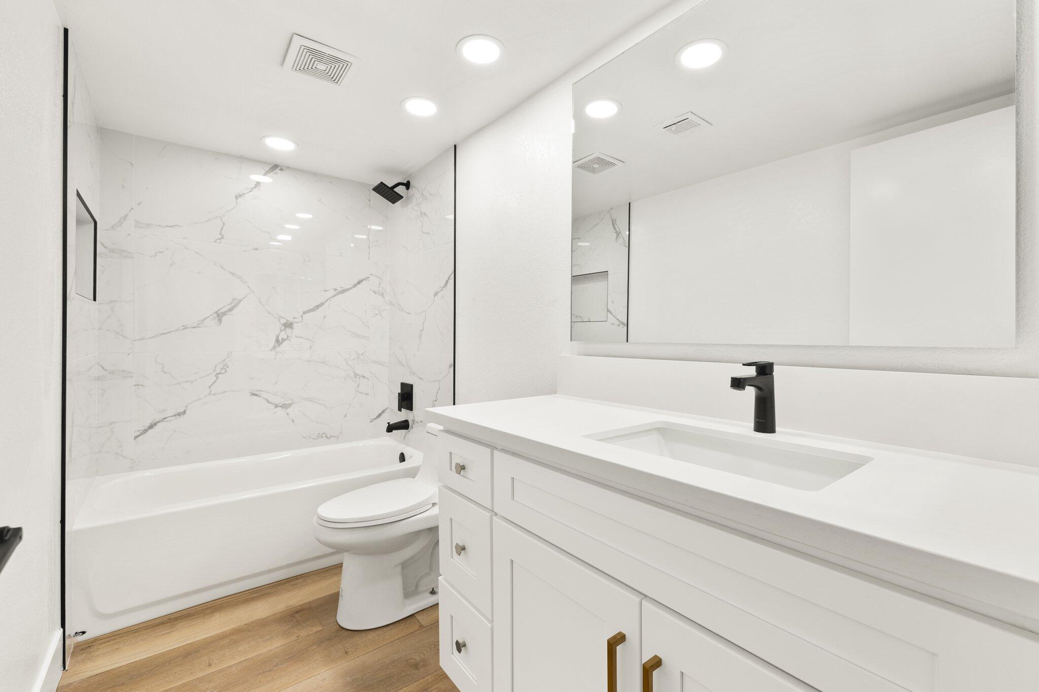 505 South Farrell Drive, Unit A3 Palm Springs, CA 92264 - Photo 10 of 43 a bathroom with a sink a toilet and a large mirror