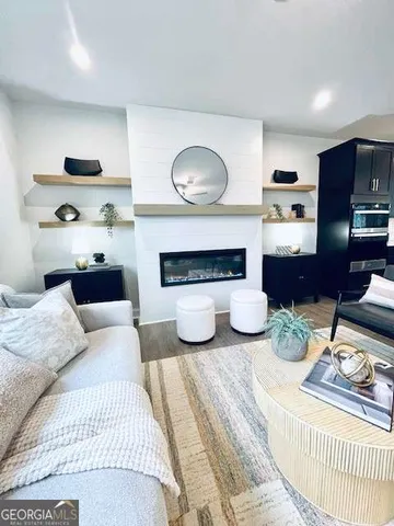 a bedroom with furniture and a lamp