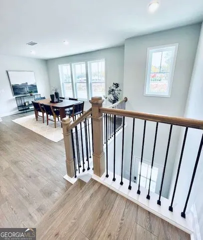 a view of a hallway with furniture and toys