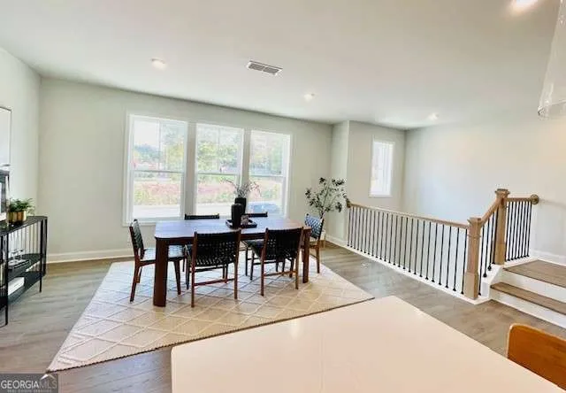 a view of a dining room with furniture and a table