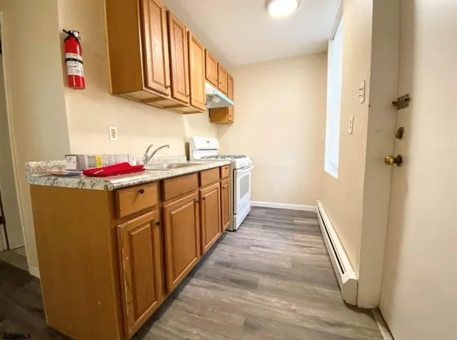 a kitchen with stainless steel appliances granite countertop a sink and dishwasher