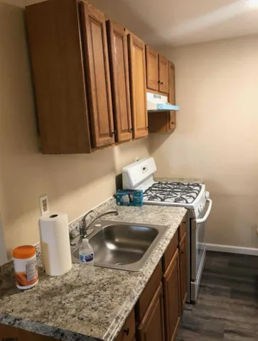 a kitchen with a stove and a sink