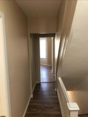 a bathroom with a toilet and a bathtub