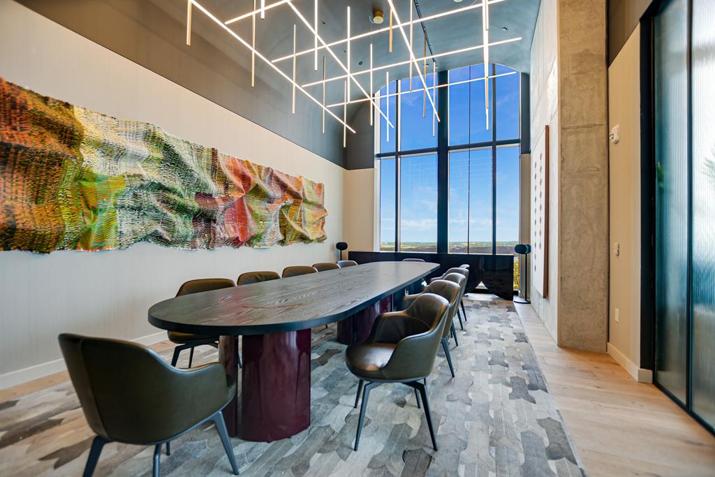 610 Davis Street, Unit 5006 Austin, TX 78701 - Photo 32 of 40 a view of a dining room with furniture and wooden floor