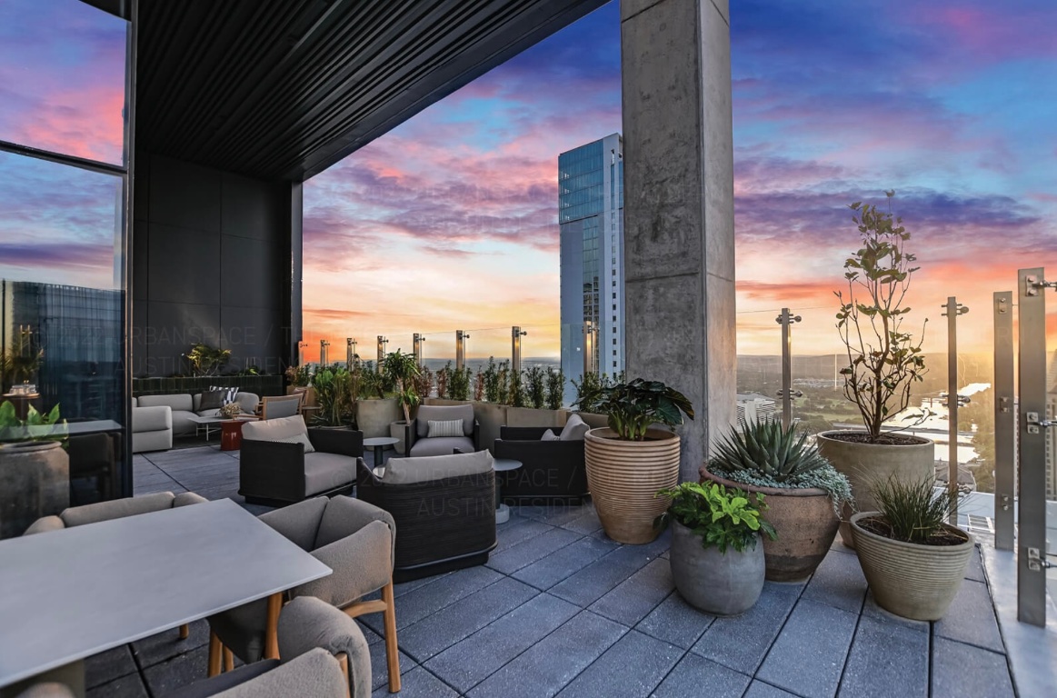 610 Davis Street, Unit 5006 Austin, TX 78701 - Photo 38 of 40 a view of a terrace with chairs and potted plants
