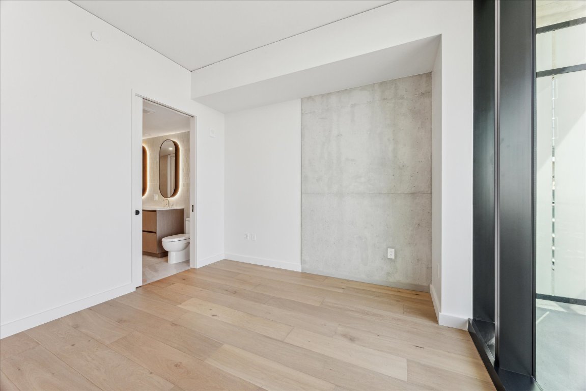 610 Davis Street, Unit 5006 Austin, TX 78701 - Photo 6 of 40 a view of empty room with wooden floor