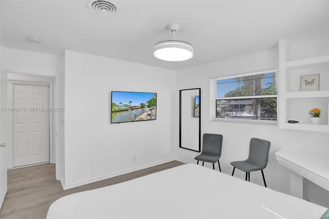 a bedroom with a bed and a chair