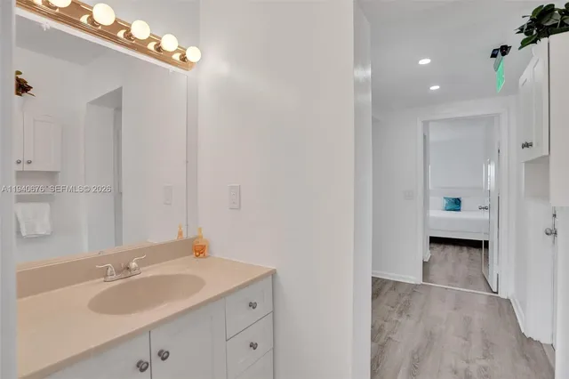 a bathroom with a sink and a mirror
