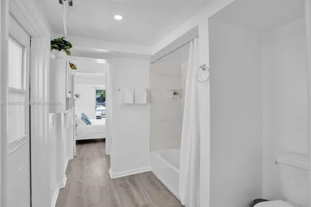 a view of entryway with livingroom and wooden floor