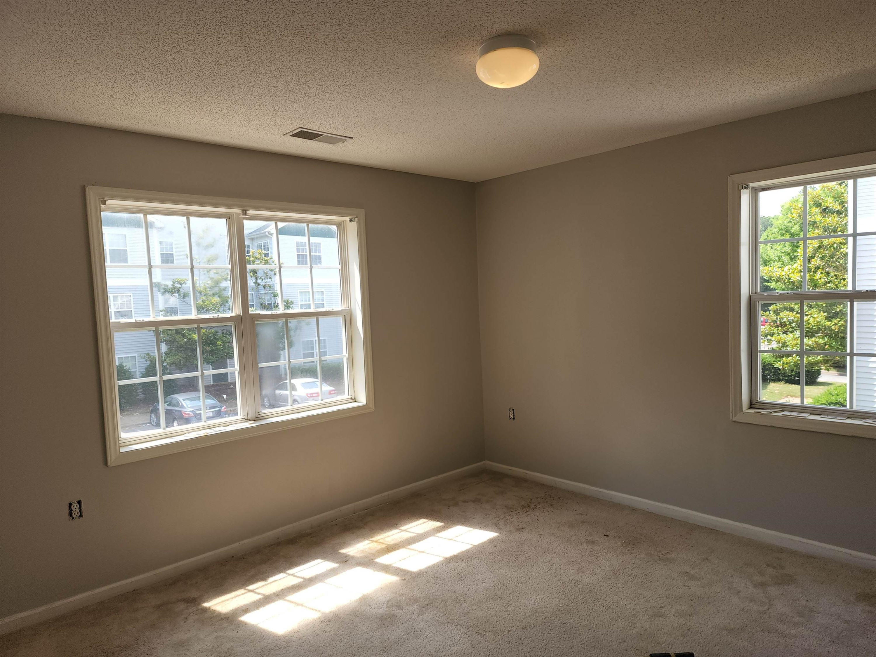 2031 Wolfmill Drive, Unit 204 Raleigh, NC 27603 - Photo 3 of 4 an empty room with a window