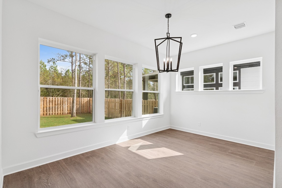 1736 Howler Way Montgomery, TX 77316 - Photo 12 of 48 Spacious Dining area that is encapsulated by lots of windows for light!