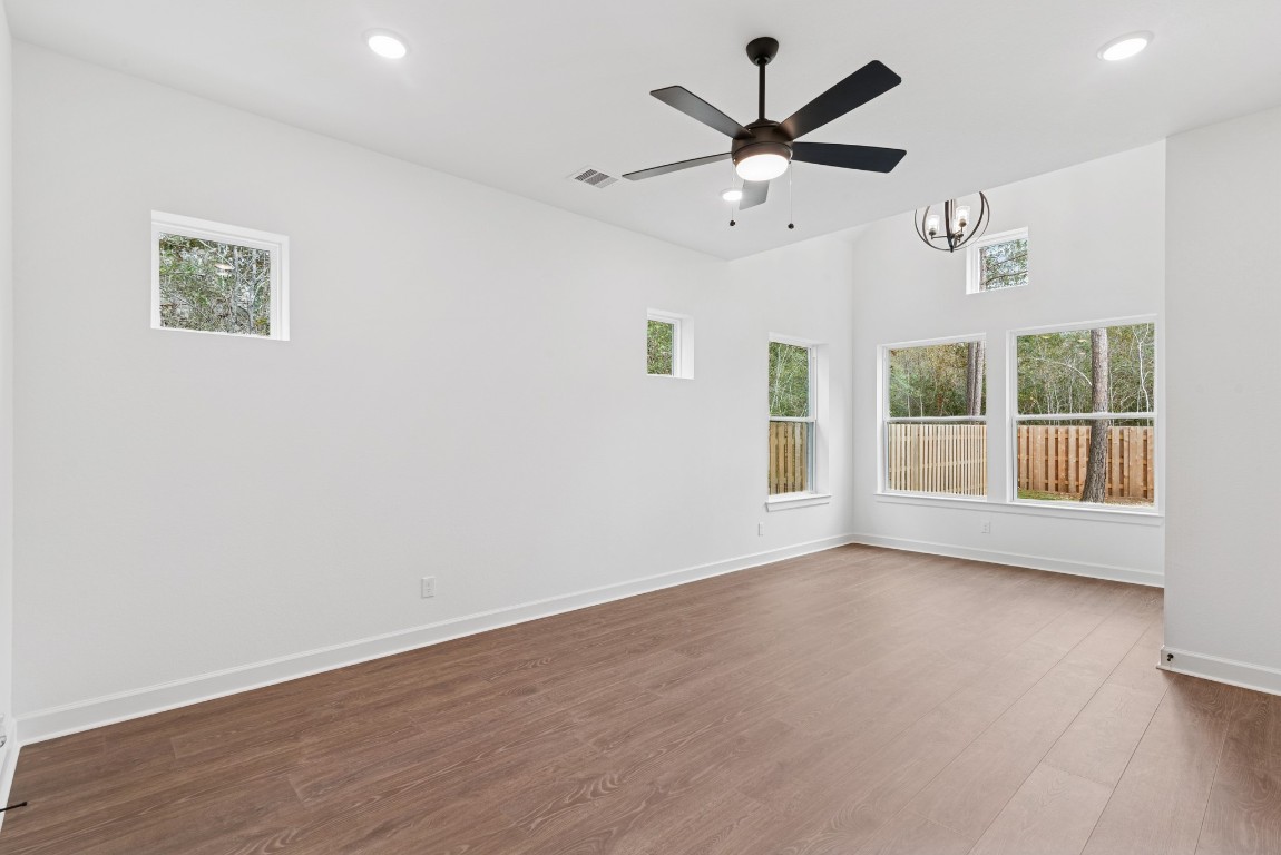 1736 Howler Way Montgomery, TX 77316 - Photo 18 of 48 Master suite is at 1st floor and offers low maintenance laminate floors & large sitting area surrounded by windows!