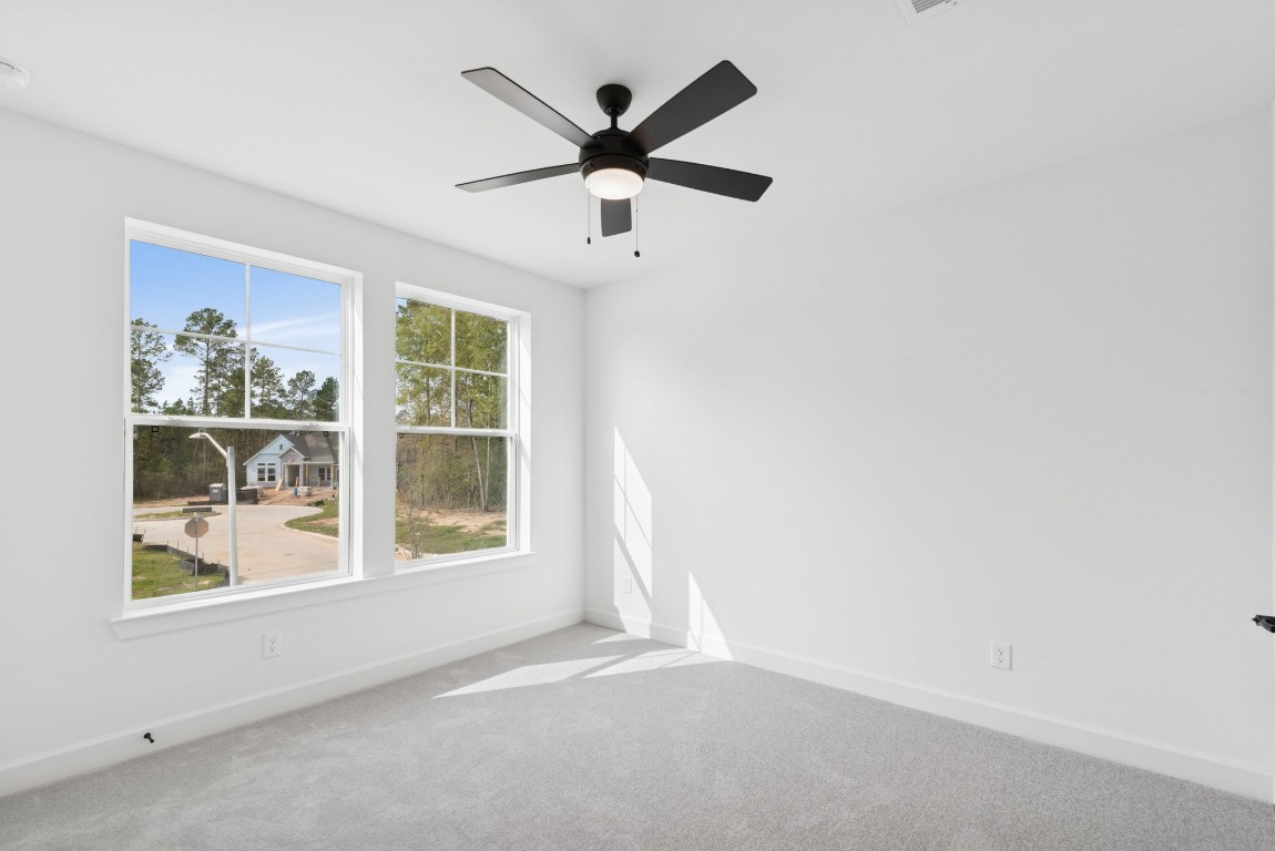 1736 Howler Way Montgomery, TX 77316 - Photo 31 of 48 Another 2ndary bedroom with big windows!