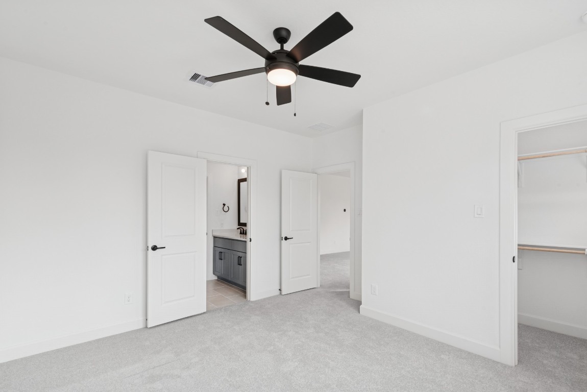 1736 Howler Way Montgomery, TX 77316 - Photo 32 of 48 Jack and jill bath with dual sinks at this bedroom. Ceiling fans in all bedrooms!