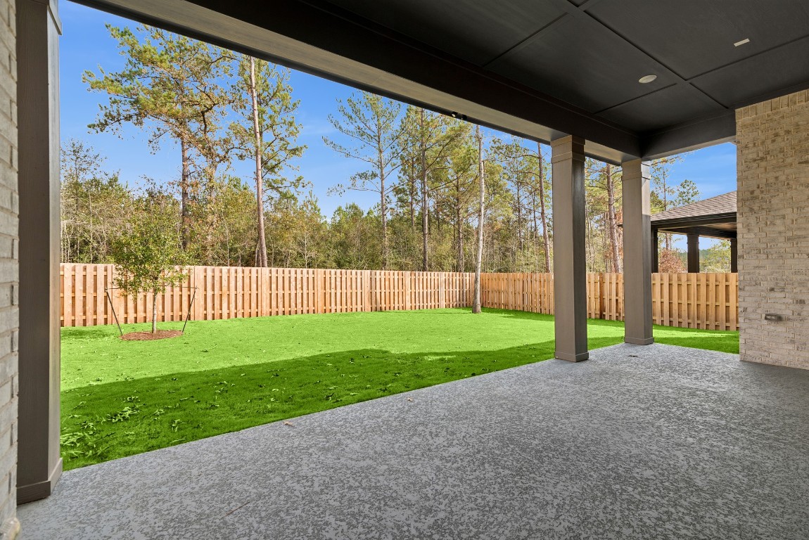 1736 Howler Way Montgomery, TX 77316 - Photo 35 of 48 Oversized Outdoor Living area with fully sodded and fenced rear yard.