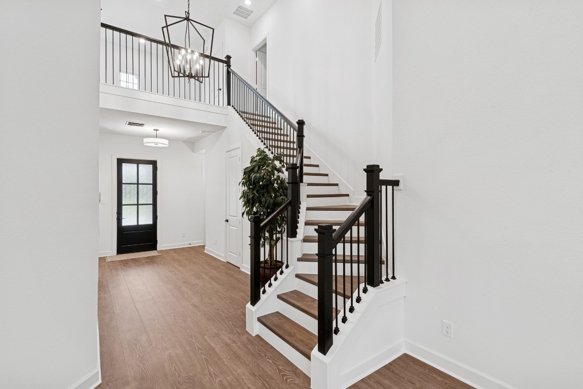 1736 Howler Way Montgomery, TX 77316 - Photo 8 of 48 Grand entry with 2 story ceiling and stairway with wood treads and iron spindles to compliment this spacious Foyer!