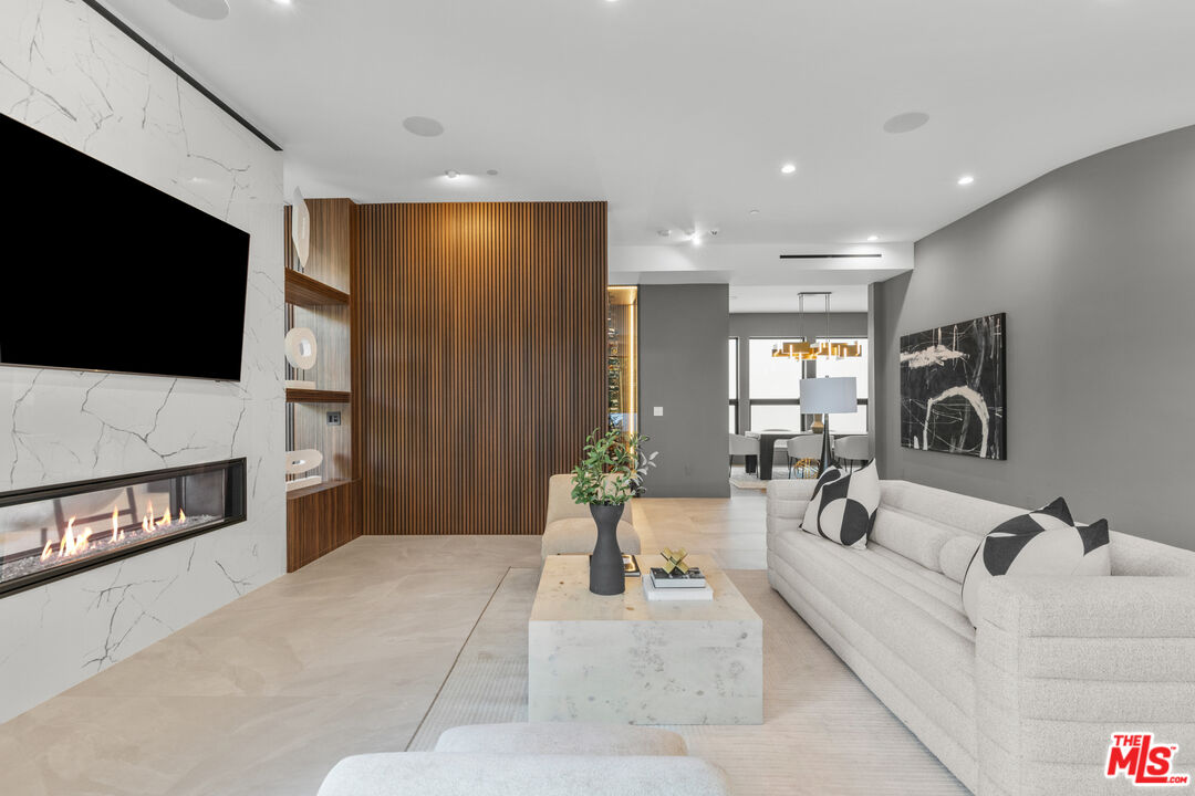 17401 Rancho Street Encino, CA 91316 - Photo 14 of 48 a living room with furniture and a flat screen tv