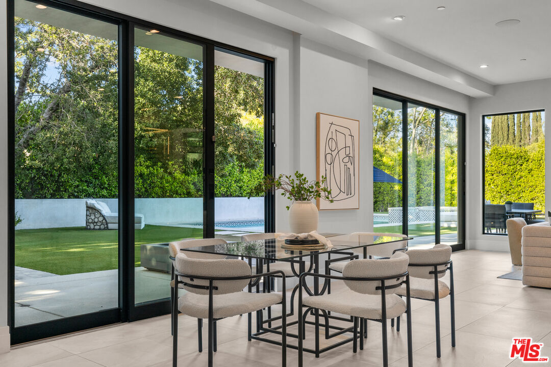 17401 Rancho Street Encino, CA 91316 - Photo 17 of 48 a view of a dining room with furniture window and outside view