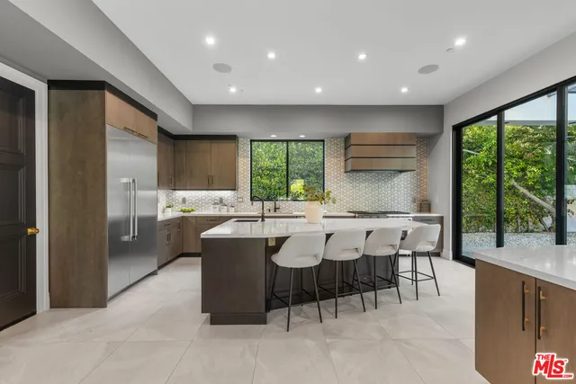 a kitchen with a table and chairs in it
