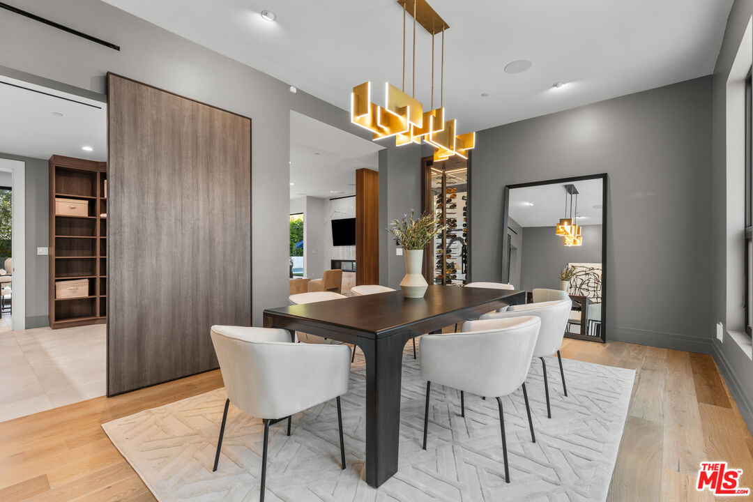 17401 Rancho Street Encino, CA 91316 - Photo 21 of 48 a view of a dining room with furniture and wooden floor