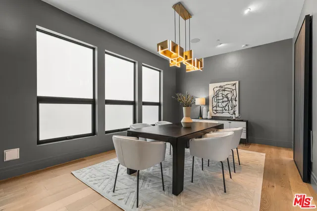 a view of a dining room with furniture window and chandelier