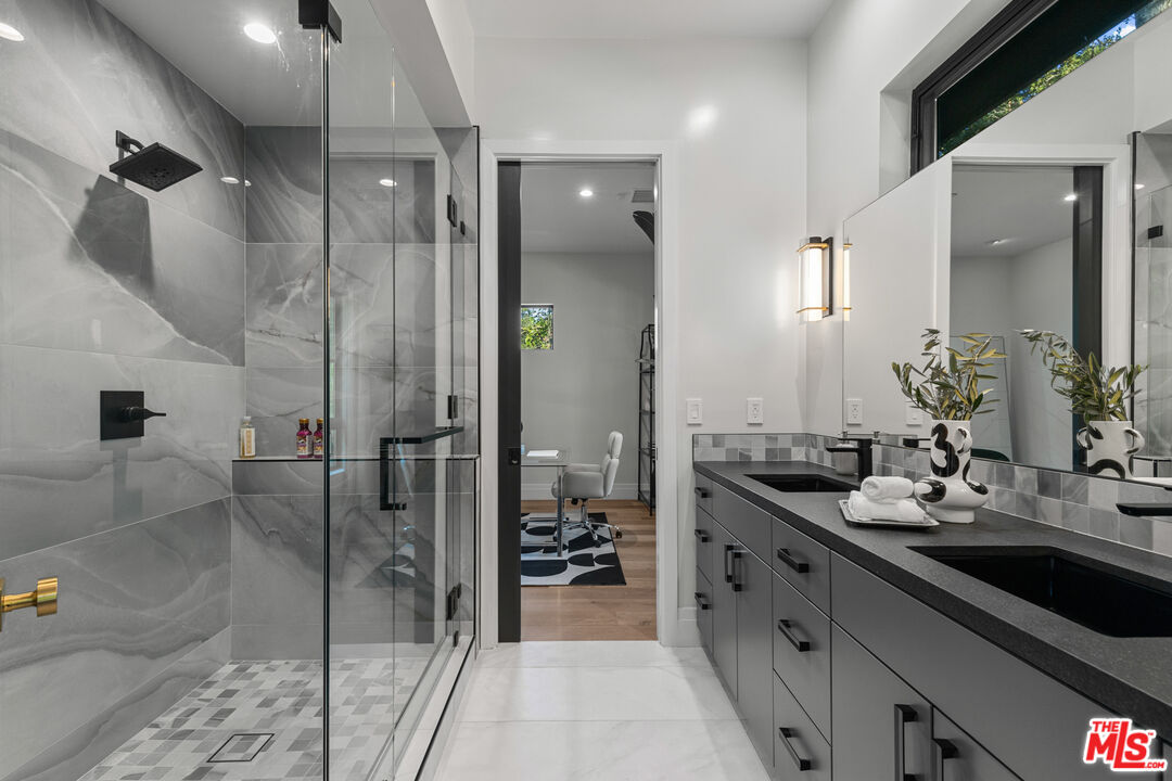 17401 Rancho Street Encino, CA 91316 - Photo 25 of 48 a bathroom with a double vanity sink and a mirror