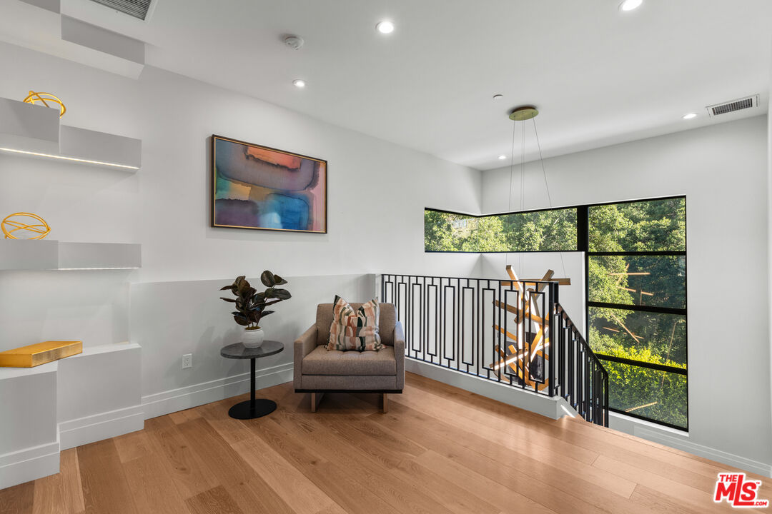17401 Rancho Street Encino, CA 91316 - Photo 29 of 48 a living room with furniture and a gate
