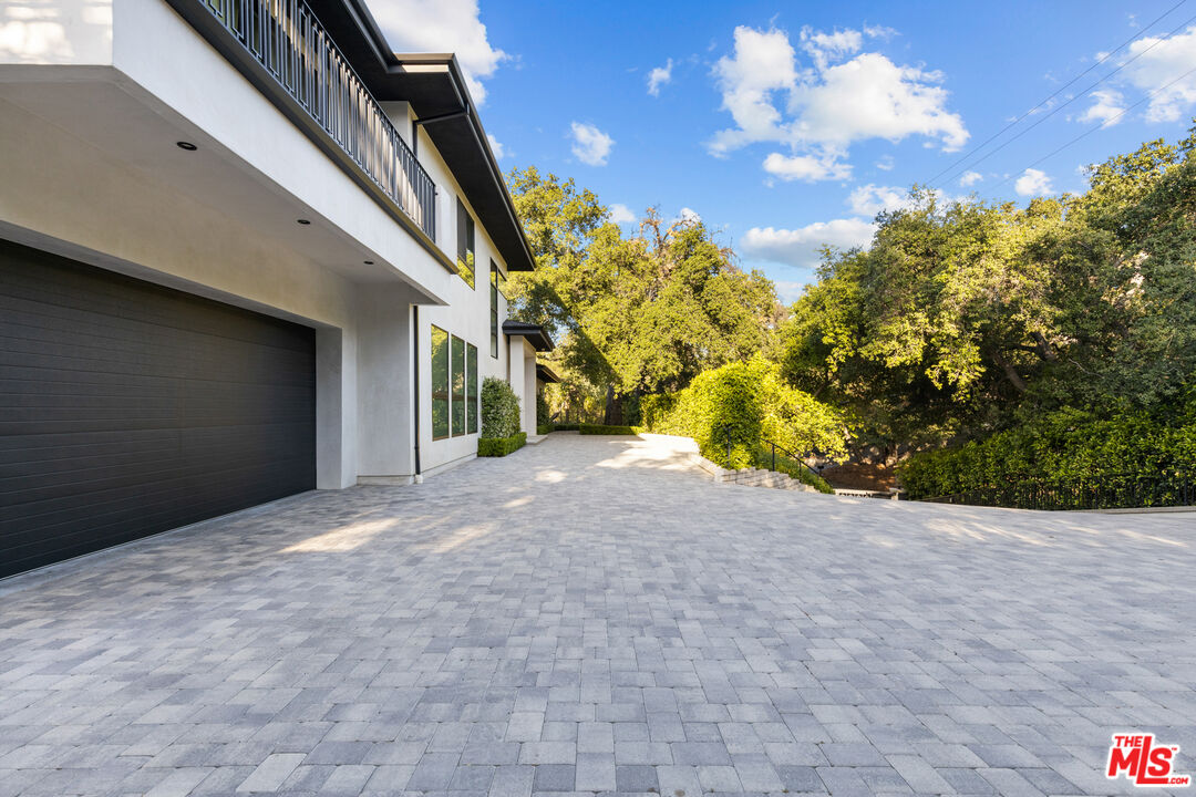 17401 Rancho Street Encino, CA 91316 - Photo 7 of 48 a view of a house with a street