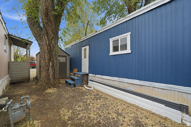 200 North Harrisville Road, Unit 37 Ogden, UT 84404 - Photo 14 of 14 View of side of home with a shed