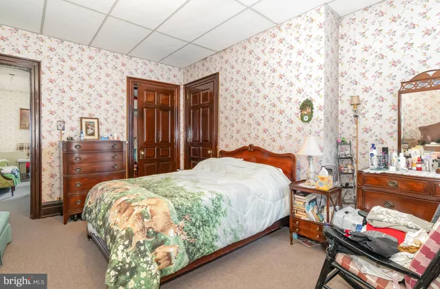 a view of a room with wooden walls and windows