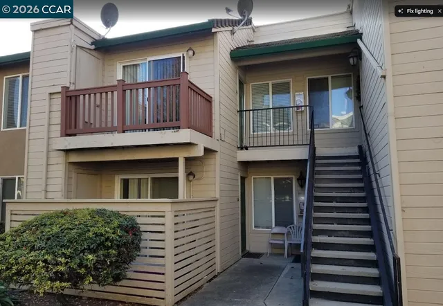 a view of a house with wooden deck