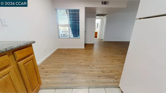 a view of bathroom with window and hardwood floor