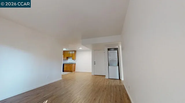 a view of a room with wooden floor and staircase