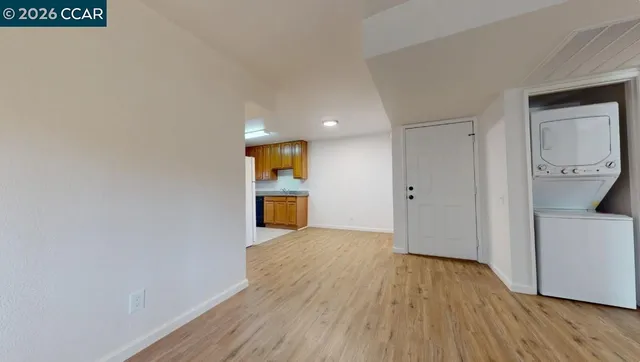 a view of storage and utility room with wooden floor